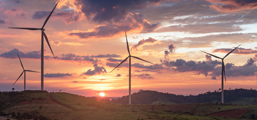 Sunset behind wind turbines